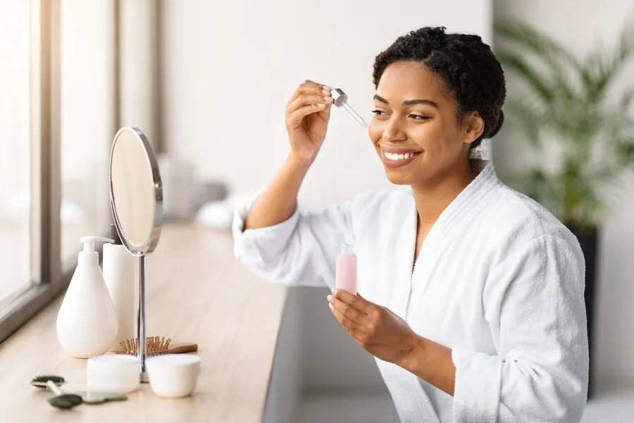 women-applying-serum-on-face